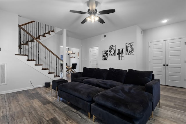 living room featuring hardwood / wood-style flooring and ceiling fan