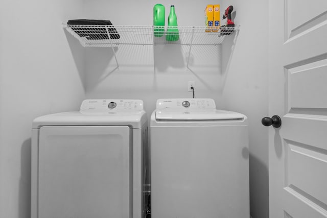 washroom with separate washer and dryer