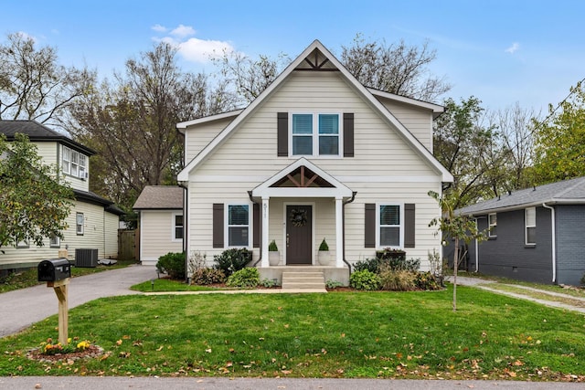 view of front of property featuring central AC and a front yard