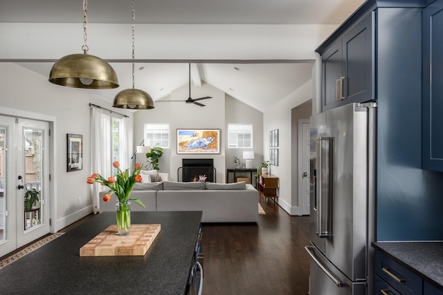 kitchen with french doors, dark wood-type flooring, blue cabinets, vaulted ceiling with beams, and high end refrigerator