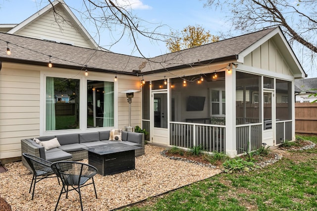 rear view of house featuring an outdoor living space and a sunroom