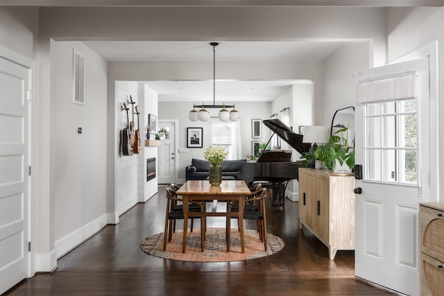 dining space featuring dark hardwood / wood-style floors