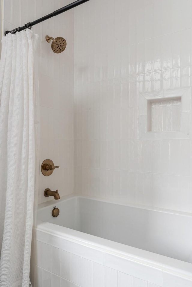 bathroom with shower / bath combination with curtain