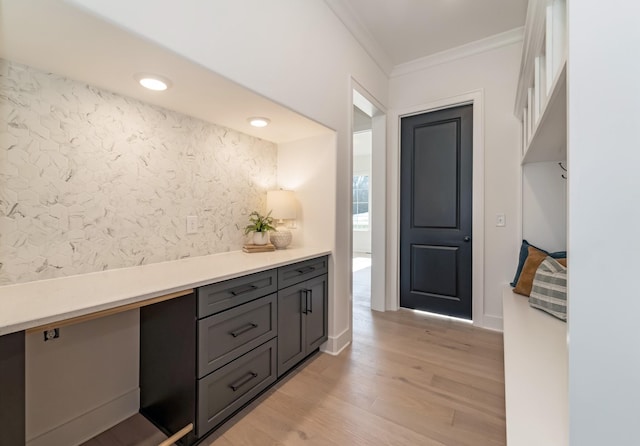 bathroom featuring hardwood / wood-style flooring and crown molding