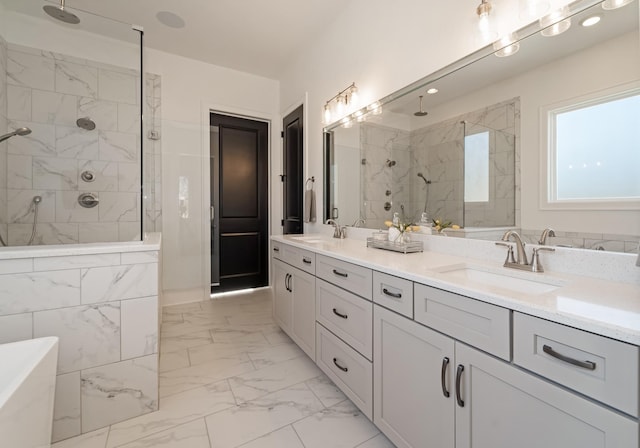 bathroom featuring vanity and tiled shower