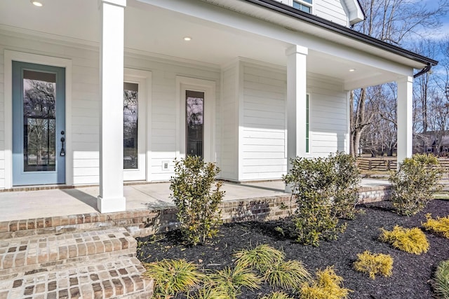 doorway to property featuring a porch