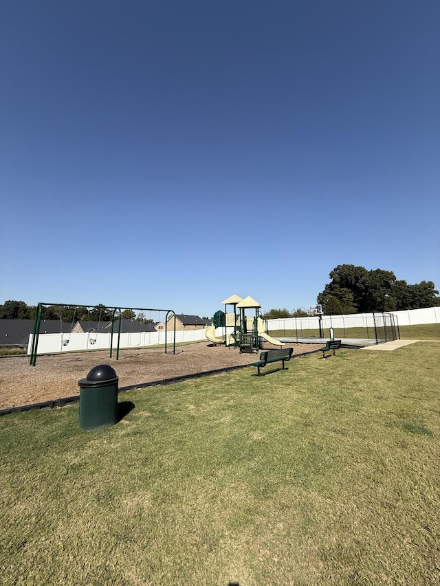 view of home's community with a yard and a playground