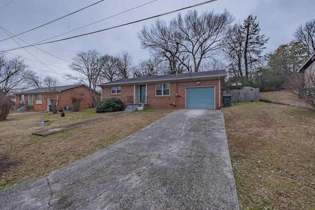 ranch-style house with a garage and a front yard