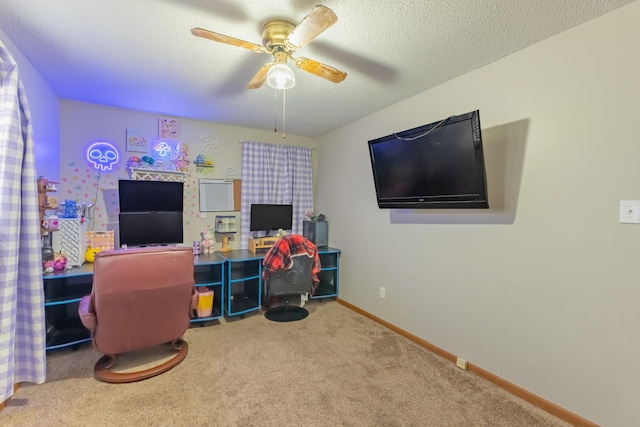 interior space with ceiling fan, carpet, and a textured ceiling