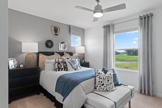 carpeted bedroom featuring ceiling fan