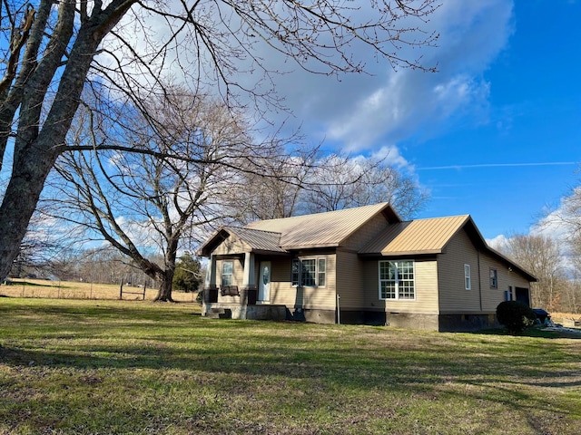 view of home's exterior with a lawn