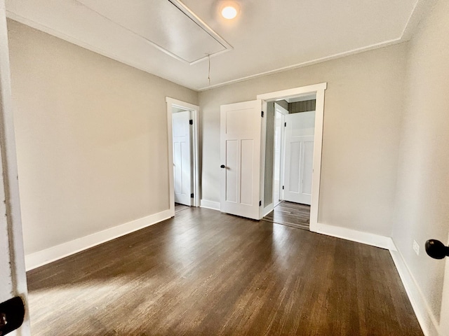 empty room featuring dark wood-type flooring