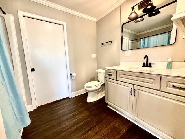 bathroom with hardwood / wood-style flooring, toilet, curtained shower, ornamental molding, and vanity