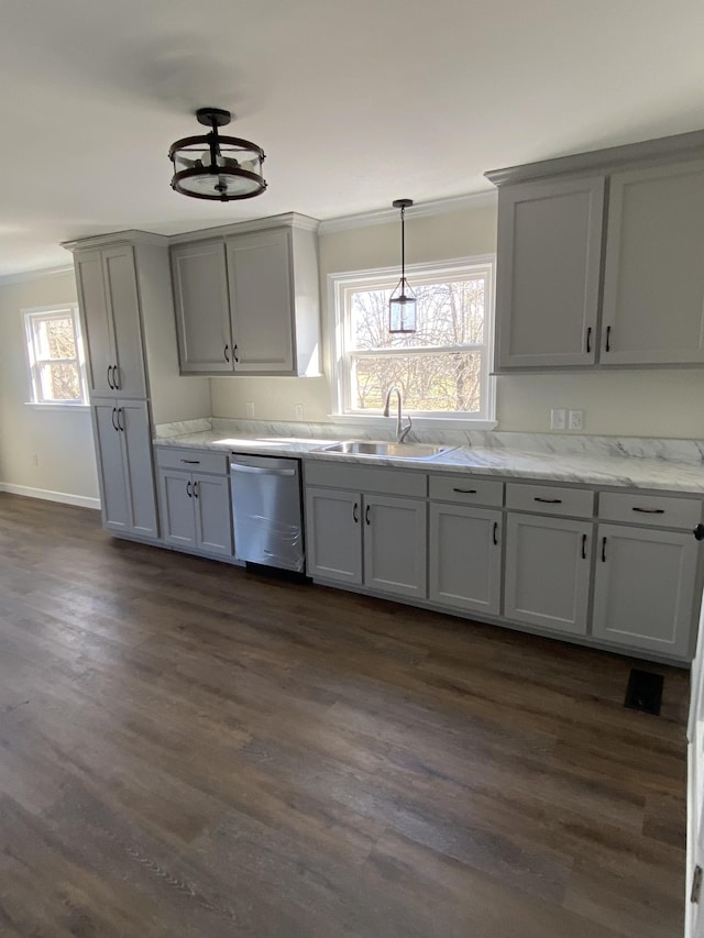 kitchen with sink, dishwasher, dark hardwood / wood-style flooring, and gray cabinetry