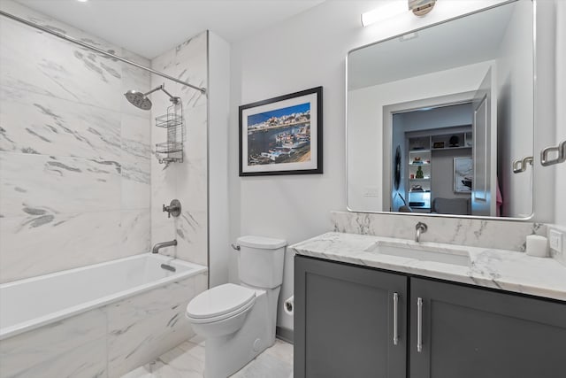 full bathroom featuring vanity, toilet, and tiled shower / bath