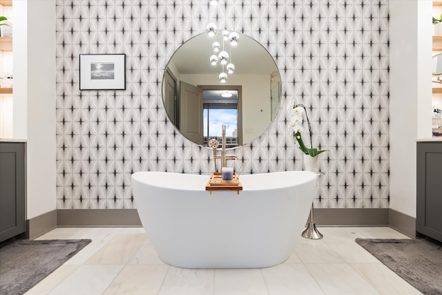 bathroom with a bath and vanity