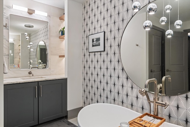 bathroom featuring a bath and vanity