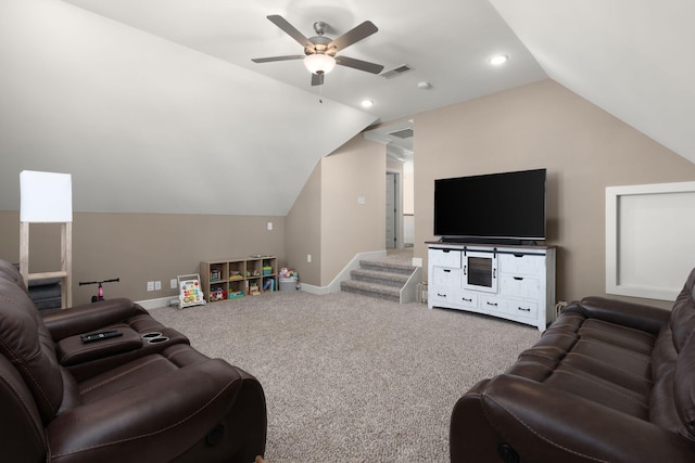 carpeted living room with ceiling fan and lofted ceiling