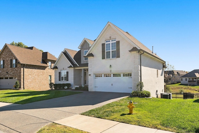 view of property featuring central AC, a garage, and a front lawn