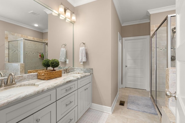 bathroom with a shower with door, crown molding, vanity, and tile patterned flooring