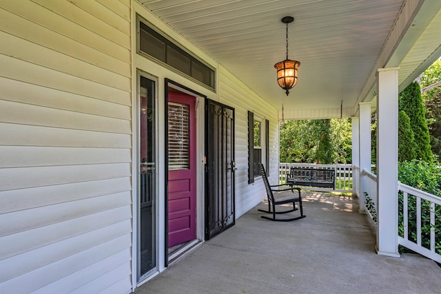 view of patio featuring a porch