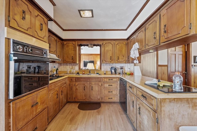 kitchen with beverage cooler, wall oven, ornamental molding, kitchen peninsula, and light wood-type flooring