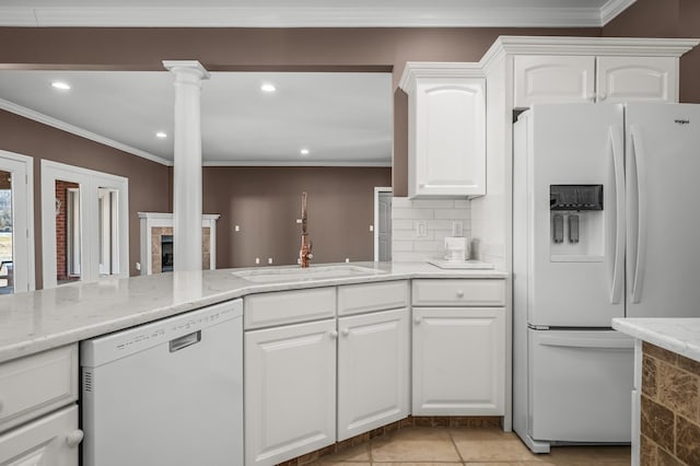 kitchen with white cabinetry, sink, white appliances, and backsplash