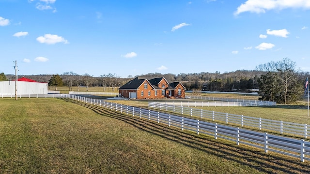 view of yard with a rural view