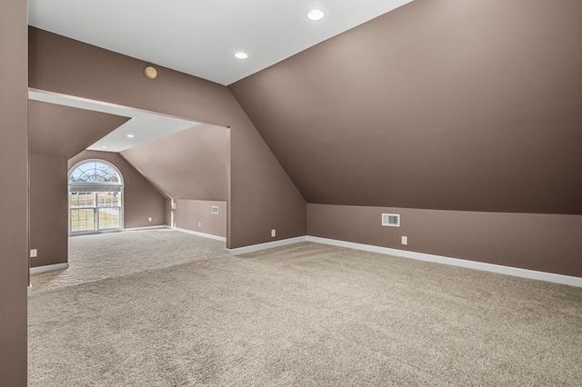 bonus room featuring carpet floors and lofted ceiling