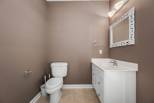 bathroom featuring vanity, toilet, and tile patterned flooring