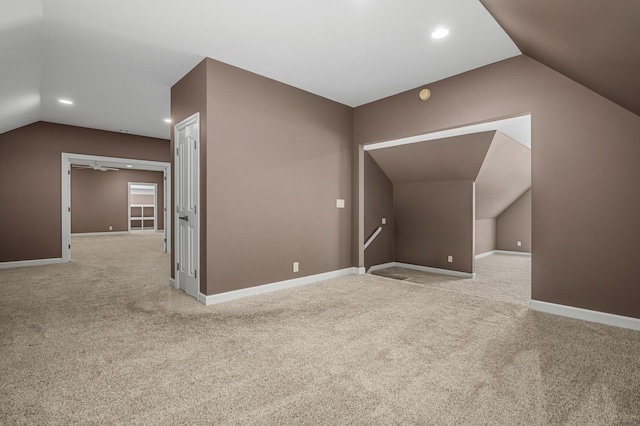 bonus room featuring light colored carpet and lofted ceiling