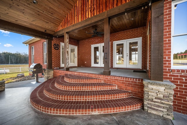 view of patio with area for grilling, covered porch, ceiling fan, and french doors