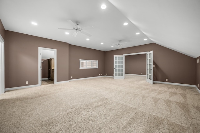 interior space featuring vaulted ceiling, ceiling fan, and french doors