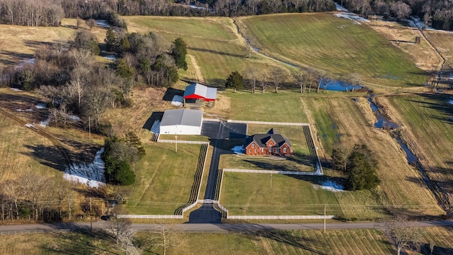 birds eye view of property with a rural view and a water view