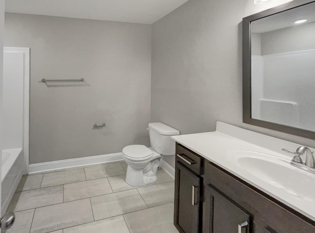 bathroom with vanity, toilet, and tile patterned flooring