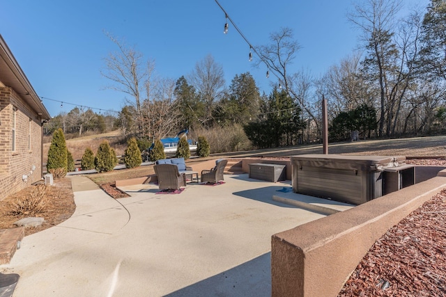 view of patio / terrace featuring a hot tub