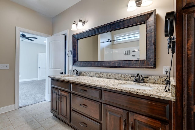 bathroom featuring vanity, a shower, tile patterned floors, and ceiling fan