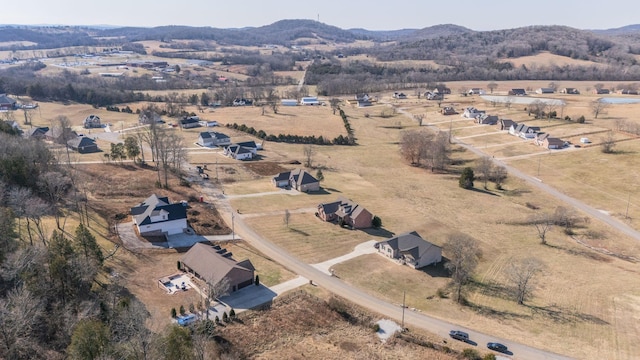 drone / aerial view with a mountain view and a rural view