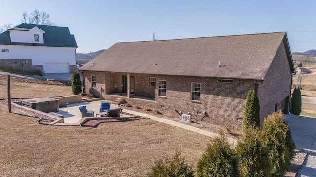 rear view of house featuring a patio