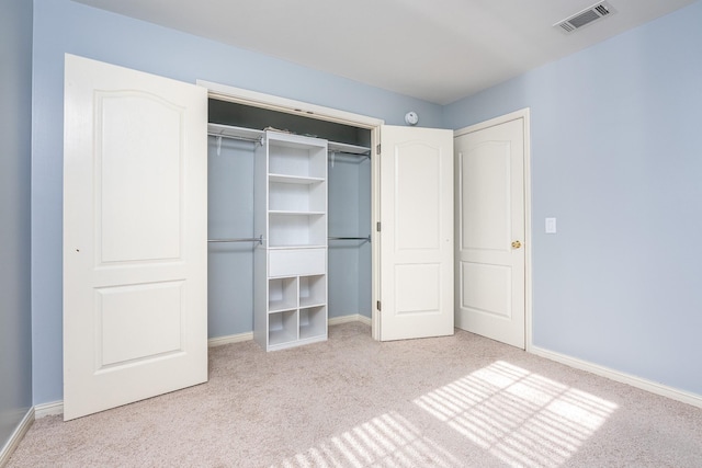 unfurnished bedroom featuring light colored carpet