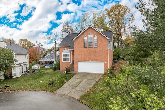 view of front property featuring a garage and a front lawn