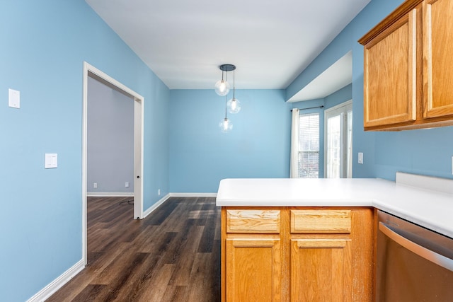 kitchen with kitchen peninsula, stainless steel dishwasher, pendant lighting, and dark hardwood / wood-style flooring