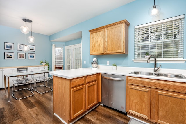 kitchen with stainless steel dishwasher, sink, decorative light fixtures, kitchen peninsula, and dark hardwood / wood-style flooring