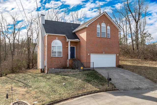 front of property with a garage and a front lawn