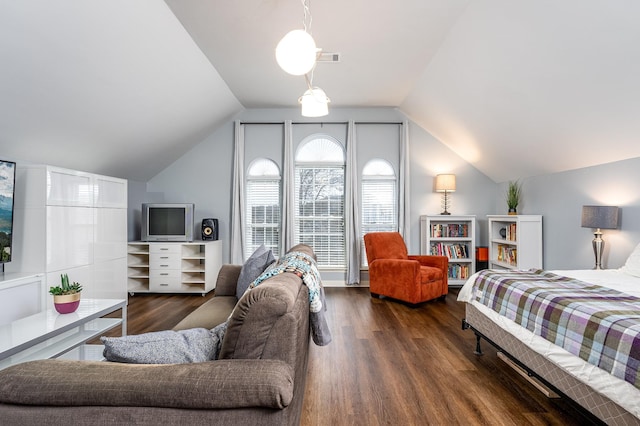 bedroom featuring dark hardwood / wood-style floors and lofted ceiling