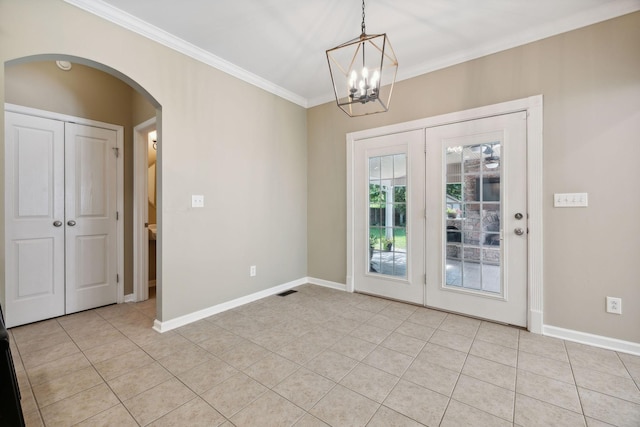 interior space featuring a chandelier, light tile patterned floors, and ornamental molding