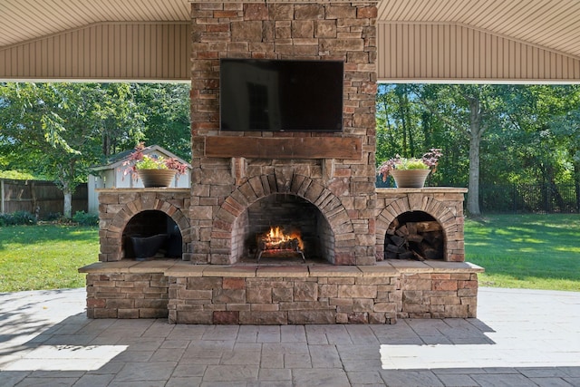 view of patio / terrace with an outdoor stone fireplace