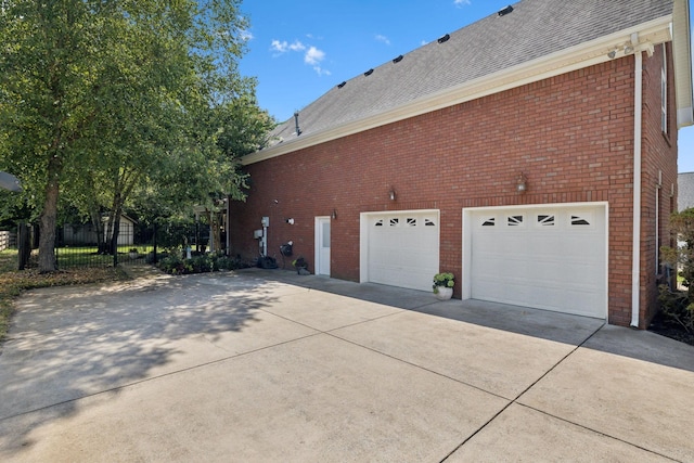 view of property exterior featuring a garage