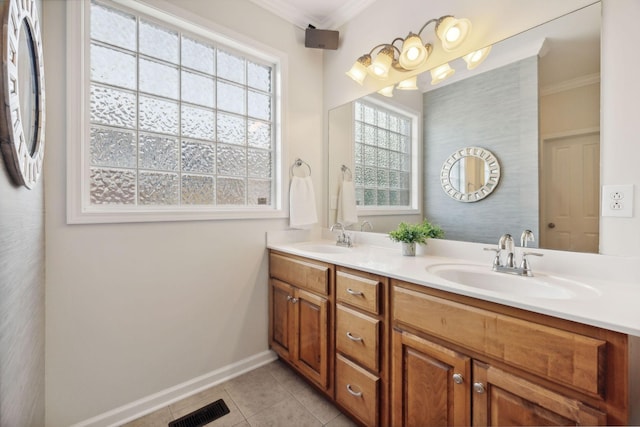 bathroom with vanity, crown molding, and tile patterned floors