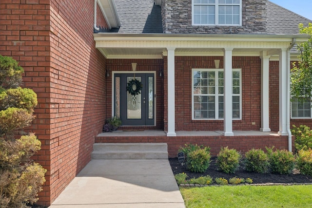 view of exterior entry with a porch